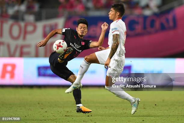 Hotaru Yamaguchi of Cerezo Osaka and Joaquin Correa of Sevilla FC compete for the ball during the preseason friendly match between Cerezo Osaka and...