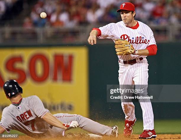 Chase Utley of the Philadelphia Phillies puts out J.D. Drew of the Boston Red Sox at second base on a double play at Citizens Bank Park June 16, 2008...