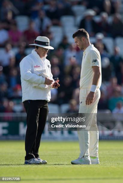 James Anderson of England asks umpire Paul Reiffel to check the ball during the first day of the second test between England and South Africa at...