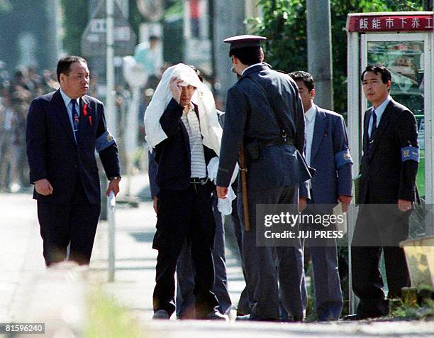 This 05 October 1989 file picture shows Tsutomu Miyazaki at an inspection of a murder case as he was convicted of killing four young girls and eating...