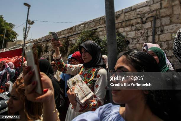 Palestinian Muslims protest outside the entrance to the old city of Jerusalem as it is partially blocked by Israeli Police on July 17, 2017 in...