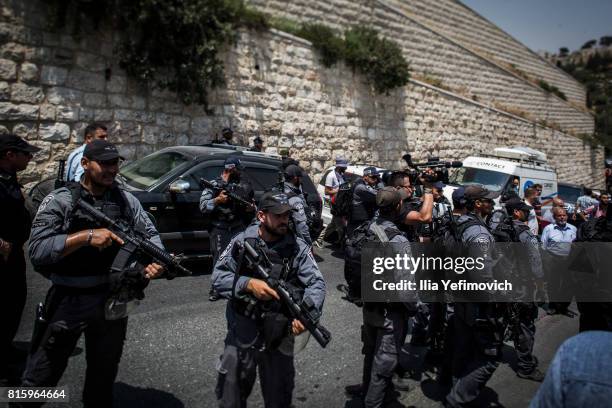 Israeli Police block the entrance to the old city of Jerusalem during a noon prayer as members of the Muslim community protest on July 17, 2017 in...