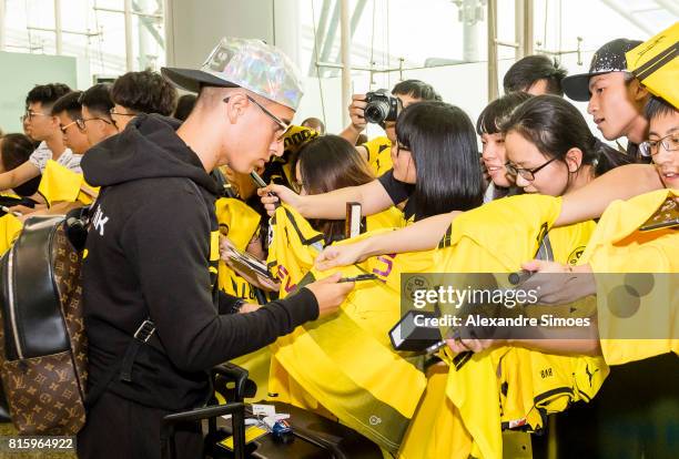 Emre Mor of Borussia Dortmund together with the chinese fans, which are welcoming the team at the airport during the Borussia Dortmund Summer Tour in...