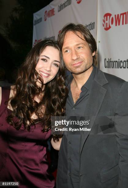 Cast members actors Madeline Zima and David Duchovny arrive at a themed poolside party for the DVD release of Californication Season 1 at an...
