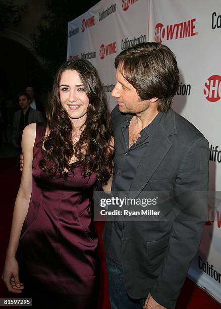 Cast members actors Madeline Zima and David Duchovny arrive at a themed poolside party for the DVD release of Californication Season 1 at an...