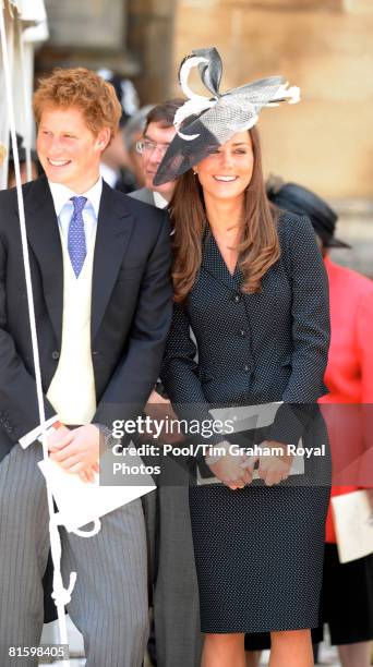 Prince Harry and Prince William's girlfriend Kate Middleton laugh together as they watch the Order of the Garter procession at Windsor Castle on June...