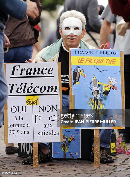 French communication company France Telecom's worker waits in Bordeaux, southwestern France, on June 17 for the departure of the demonstration of...