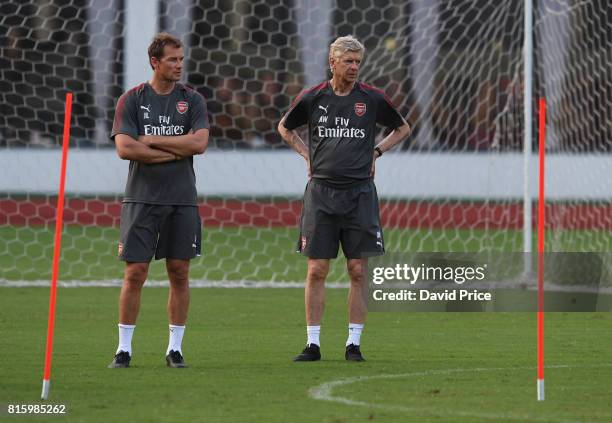 Arsene Wenger the Manager of Arsenal with 1st team coach Jens Lehmann during an Arsenal Training Session at Yuanshen Sports Centre Stadium on July...