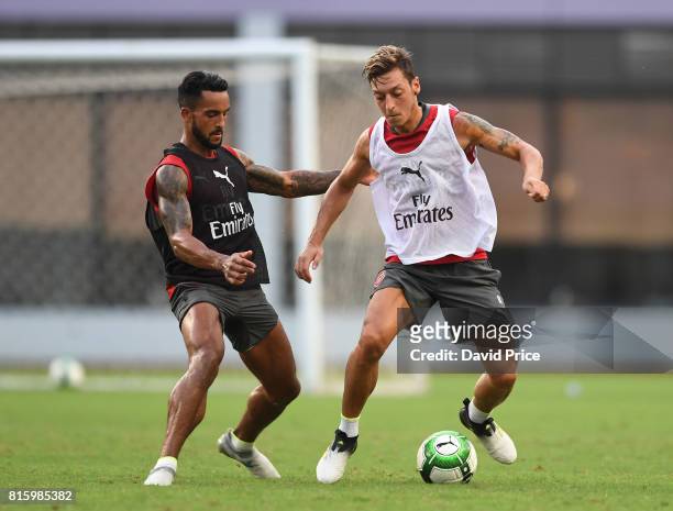Mesut Ozil and Theo Walcott of Arsenal during an Arsenal Training Session at Yuanshen Sports Centre Stadium on July 17, 2017 in Shanghai, China.