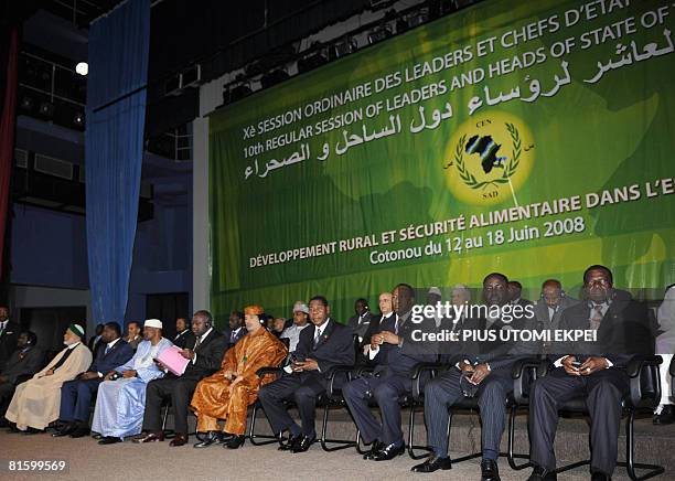 Heads of State of member countries listen to a solidarity message at the opening of the 10th summit of Community of Sahel-Saharan States in Cotonou...