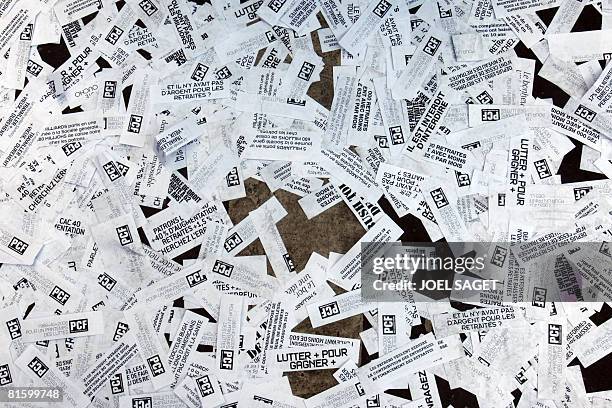 Photo taken on June 17, 2008 in Paris of stickers on the ground during a demonstration of thousands of people as part of a nationwide strike called...