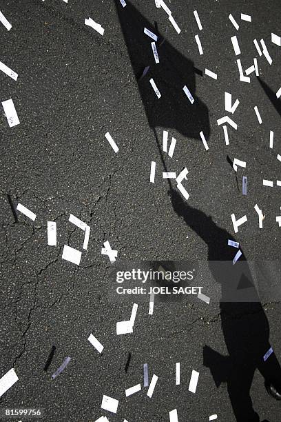 Photo a the shadow of a person attending a demonstration of thousands of people taken on June 17, 2008 in Paris, as part of a nationwide strike...