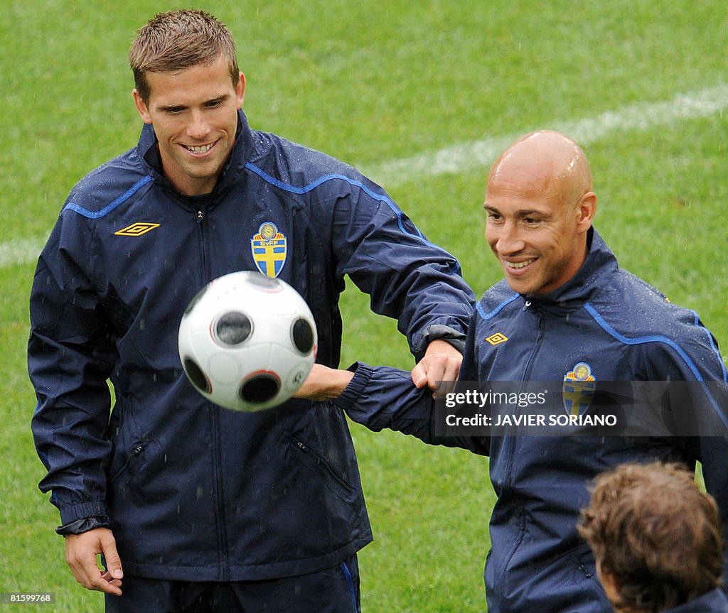 Swedish forward Marcus Allback (L) and S