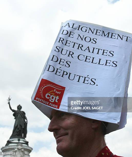 Man attends a demonstration of thousands of people as part of a nationwide strike called by the two biggest unions CGT and CFDT on June 17, 2008 in...