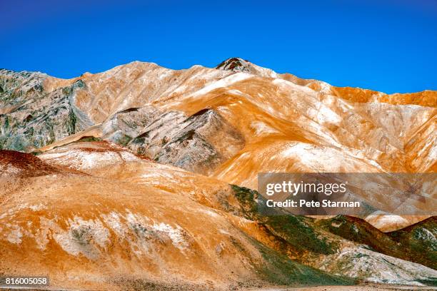 zabriskie point, death valley, ca. - amargosa mountains stock-fotos und bilder