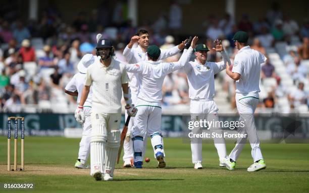 South Africa celebrate as Duanne Olivier is congratulated after dismissing Mark Wood during day four of the 2nd Investec Test match between England...