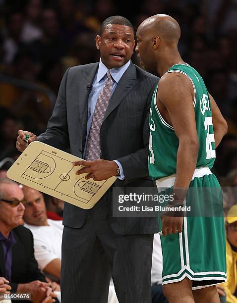 Head coach Doc Rivers of the Boston Celtics talks with Sam Cassell while taking on the Los Angeles Lakers in Game Five of the 2008 NBA Finals on June...