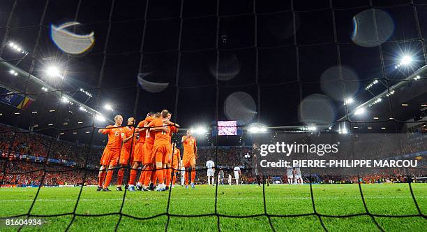 The Dutch team celebrate on the pitch at the end of the Euro 2008 Championships Group C football match Netherlands vs. Romania on June 17, 2008 at...