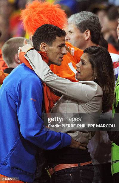 Dutch defender Khalid Boulahrouz hugs his girlfriend as he celebrates after the Euro 2008 Championships Group C football match Netherlands vs....