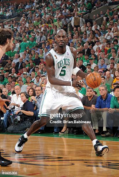 Kevin Garnett of the Boston Celtics moves the ball against Pau Gasol of the Los Angeles Lakers in Game Two of the NBA Finals at the TD Banknorth...