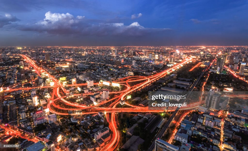 Modern buildings and road in modern city at night