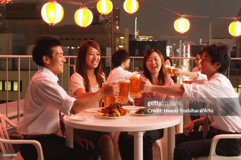 People Enjoying Beer and Snacks