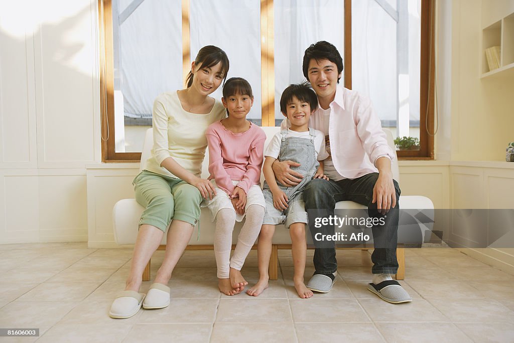 Family Sitting Down on Couch