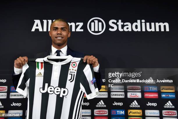 Douglas Costa of Juventus attends a press conference on July 17, 2017 in Turin, Italy.