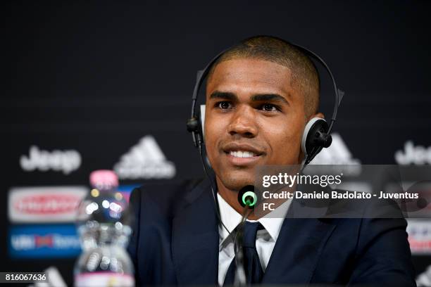 Douglas Costa of Juventus attends a press conference on July 17, 2017 in Turin, Italy.