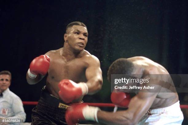 Boxer Mike Tyson knocks Tyrell Biggs to the canvas at Tyson vs Biggs Convention Hall in Atlantic City, New Jersey October 16th 1987.