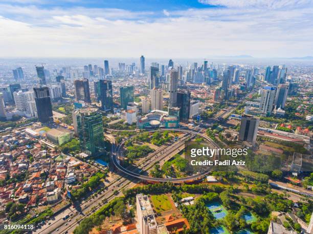 jakarta's new icon, semanggi overpass, in a super bright day - jakarta stock pictures, royalty-free photos & images