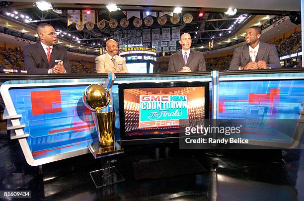 Sportscaster Stuart Scott, sportswriter Michael Wilbon, analyst Jon Barry of ESPN and Dwyane Wade of the Miami Heat talk on the set of the GMC NBA...
