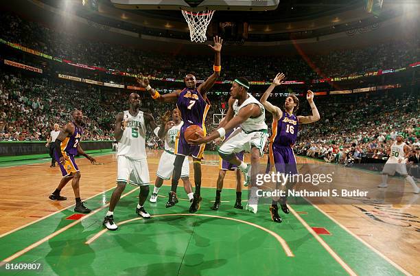 Paul Pierce of the Boston Celtics passes to teammate Kevin Garnett against Lamar Odom and Pau Gasol of the Los Angeles Lakers in Game Six of the 2008...