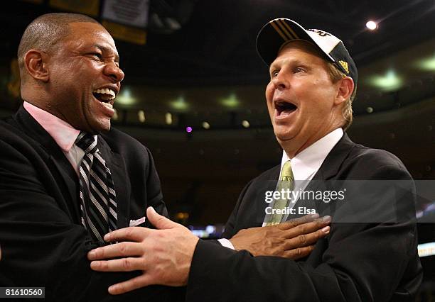 Head coach Doc Rivers and Executive Director of Basketball Operations Danny Ainge of the Boston Celtics celebrate after defeating the Los Angeles...