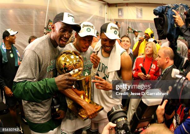 Kevin Garnett, Ray Allen and Paul Pierce of the Boston Celtics celebrate with the Larry O'Brien championship trophy after defeating the Los Angeles...