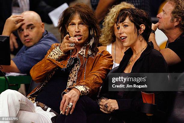 Aerosmith frontman Steven Tyler and girlfriend Erin Brady attend Game Six of the 2008 NBA Finals between the Los Angeles Lakers and the Boston...