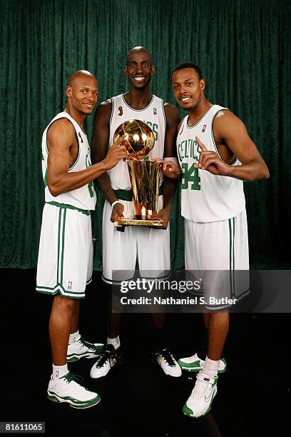 Ray Allen, Kevin Garnett, and Paul Pierce of the Boston Celtics poses for a portrait with the Larry O'Brien trophy after defeating the Los Angeles...