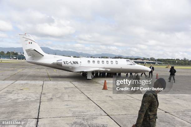 Javier Duarte , former governor of the Mexican state of Veracruz, board the aircraft to be extradited to Mexico, in Guatemala City, on July 17, 2017....