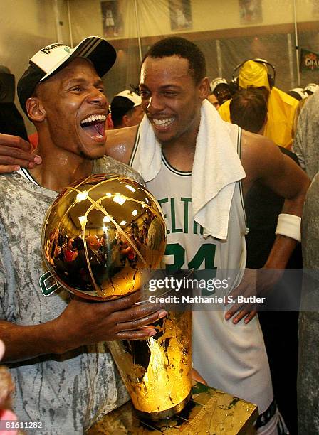 Ray Allen and Paul Pierce of the Boston Celtics hold the Larry O'Brien trophy while celebrating after the defeat of the Los Angeles Lakers in Game...