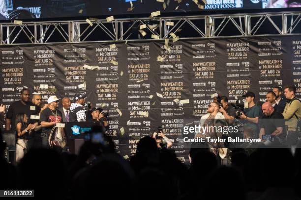 Floyd Mayweather Jr. And Conor McGregor on stage to promote their upcoming Super Welterweight fight during New York leg of press tour at Barclays...