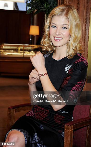 Actress Rosamund Pike poses to launch the the Cartier Love Charity Bracelet in support of Action Against Hunger, at Cartier New Bond Street on June...