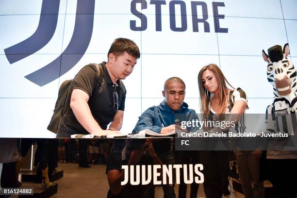 Douglas Costa of Juventus poses for a picture on July 17, 2017 in Turin, Italy.