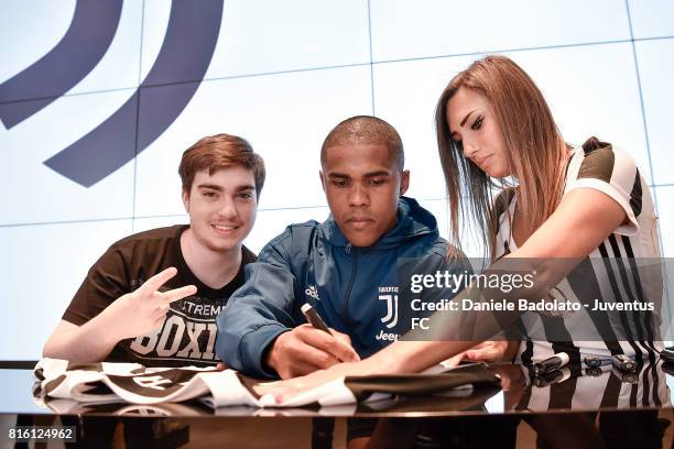 Douglas Costa of Juventus poses for a picture on July 17, 2017 in Turin, Italy.