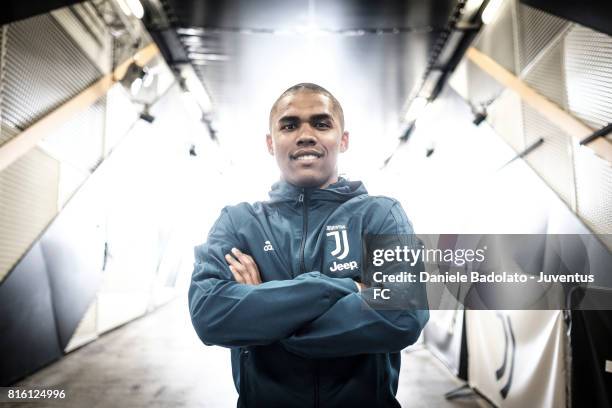 Douglas Costa of Juventus poses for a picture on July 17, 2017 in Turin, Italy.