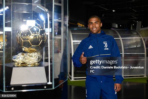 Douglas Costa of Juventus poses for a picture on July 17, 2017 in Turin, Italy.