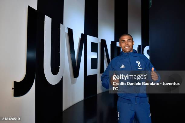 Douglas Costa of Juventus poses for a picture on July 17, 2017 in Turin, Italy.