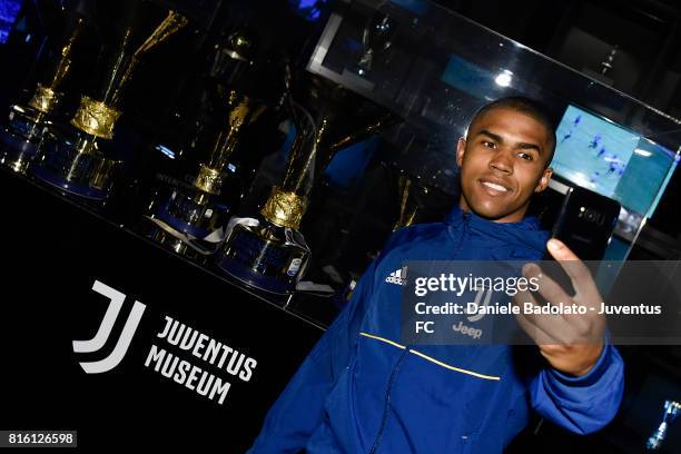 Douglas Costa of Juventus poses for a picture on July 17, 2017 in Turin, Italy.