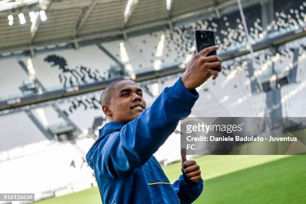 Douglas Costa of Juventus poses for a picture on July 17, 2017 in Turin, Italy.