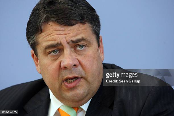German Environment Minister Sigmar Gabriel speaks to the media with Transport Minister Wolfgang Tiefensee and Economy Minister Michael Glos after the...