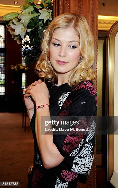 Actress Rosamund Pike poses to launch the the Cartier Love Charity Bracelet in support of Action Against Hunger, at Cartier New Bond Street on June...